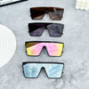 A collection of four retro square sunglasses in various colors including brown, purple, pink, and blue shades