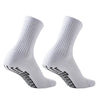A pair of white athletic grip socks shown from the side.
