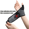 A hand is wearing a black compression wristband on the wrist, demonstrating strap calibration.