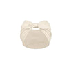 A beige solid bow headband for hair styling and workout.