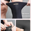 Black high elasticity knee sleeve with a soft gel layer shown on a person's leg.