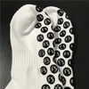 White anti-slip silicone grip football socks with a black repeating logo pattern.