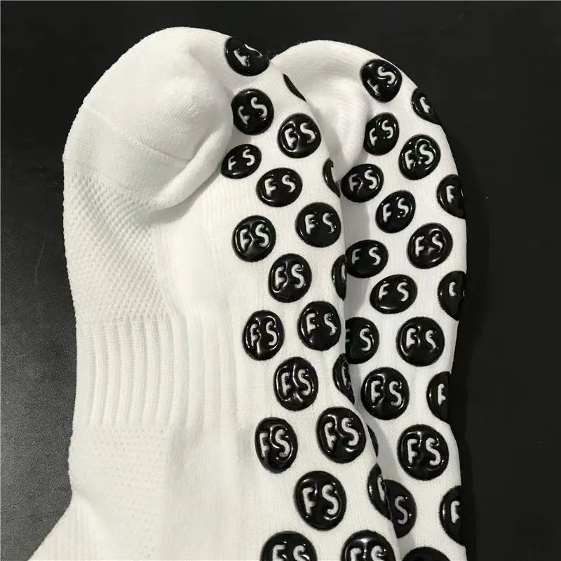 White anti-slip silicone grip football socks with a black repeating logo pattern.