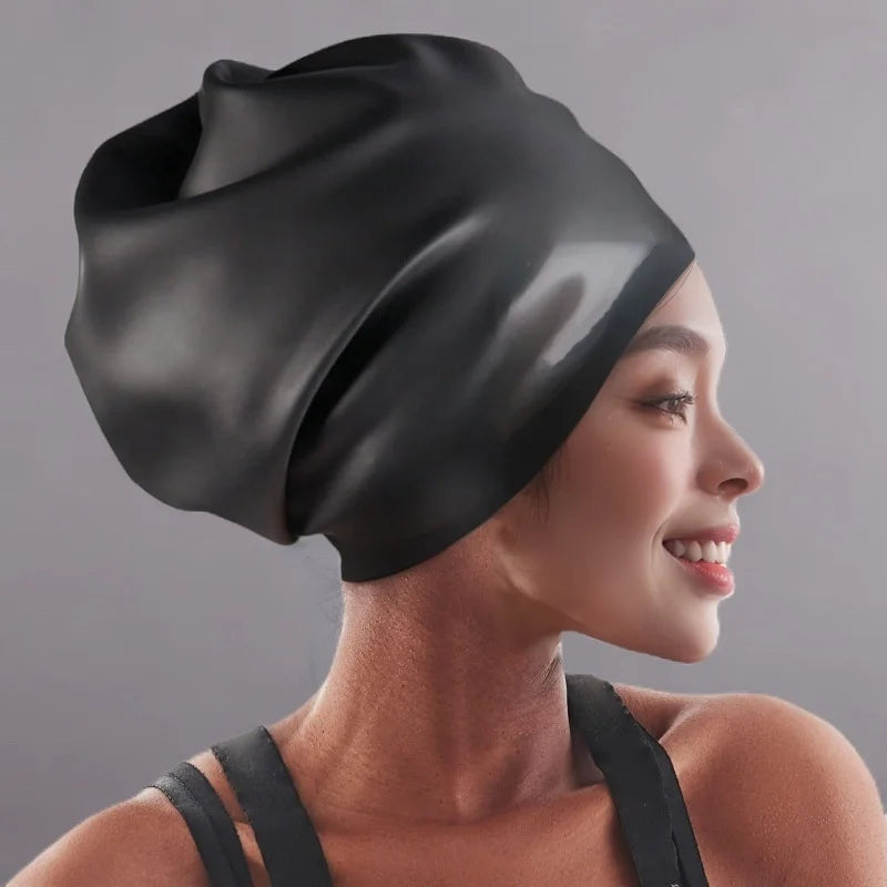 A woman wearing a black waterproof silicone swim cap for hair extensions, shown in profile.