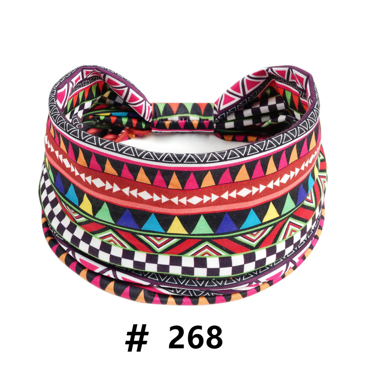 A colorful patterned fabric headband featuring geometric designs in pink, black, green, and red.