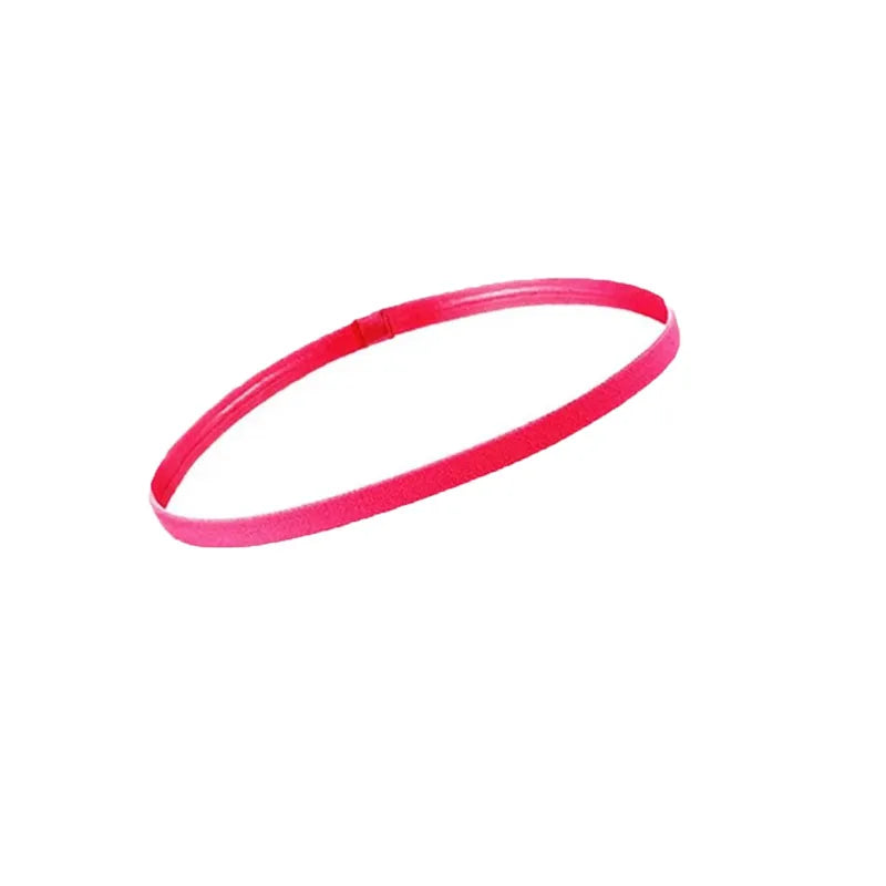 A pink elastic sports headband is shown against a white background.