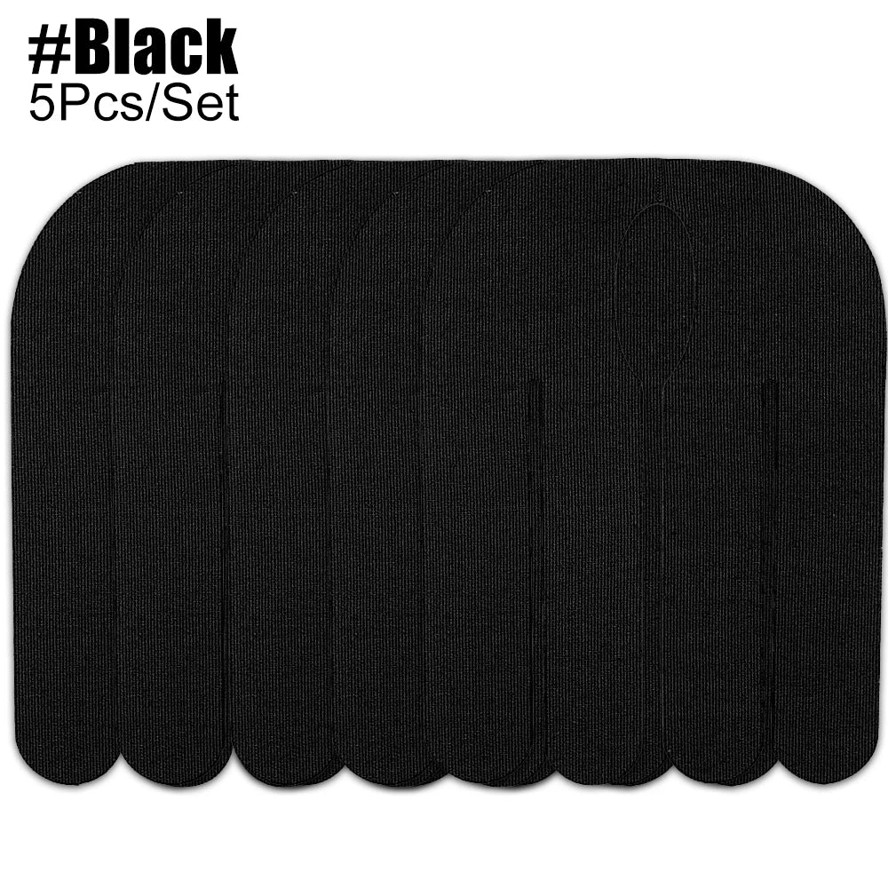 A set of five black kinesiology tapes for sports recovery.
