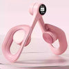 A pink thigh and hip strength trainer with a digital display showing 666, resting on a clear surface.