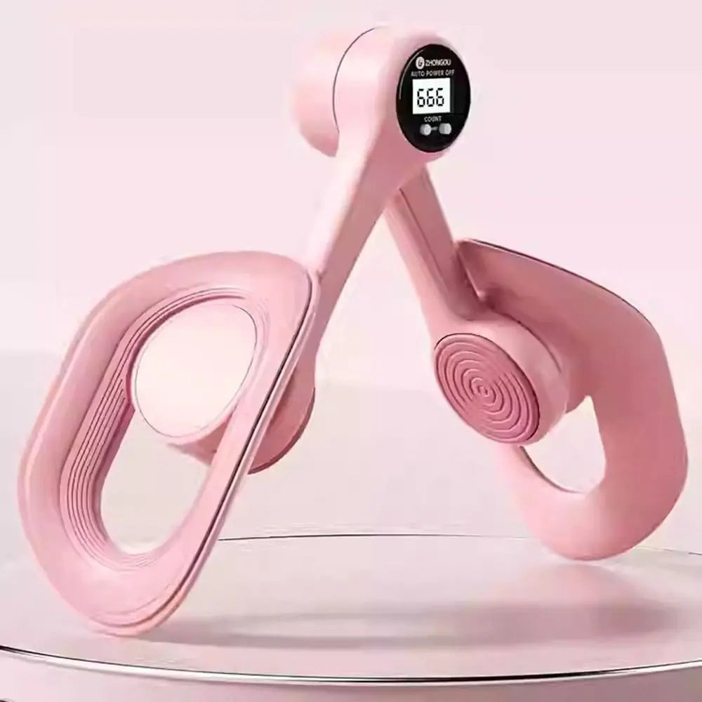 A pink thigh and hip strength trainer with a digital display showing 666, resting on a clear surface.
