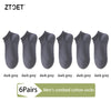 A set of six dark grey men's combed cotton socks displayed side by side.