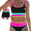 A model wears a color-block zigzag three-piece swimsuit set featuring black, pink, and teal stripes.