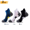 Three pairs of men's performance running and sport socks in dark blue, white, and black.