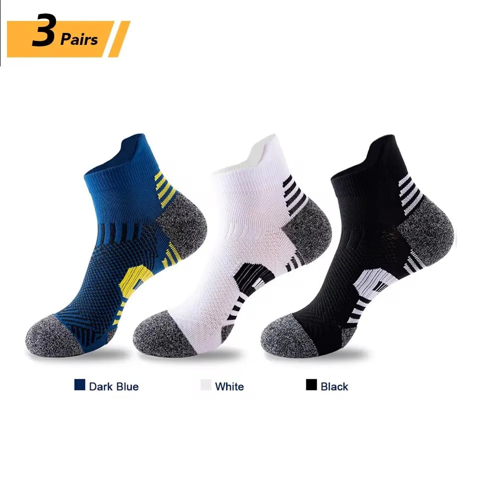 Three pairs of men's performance running and sport socks in dark blue, white, and black.