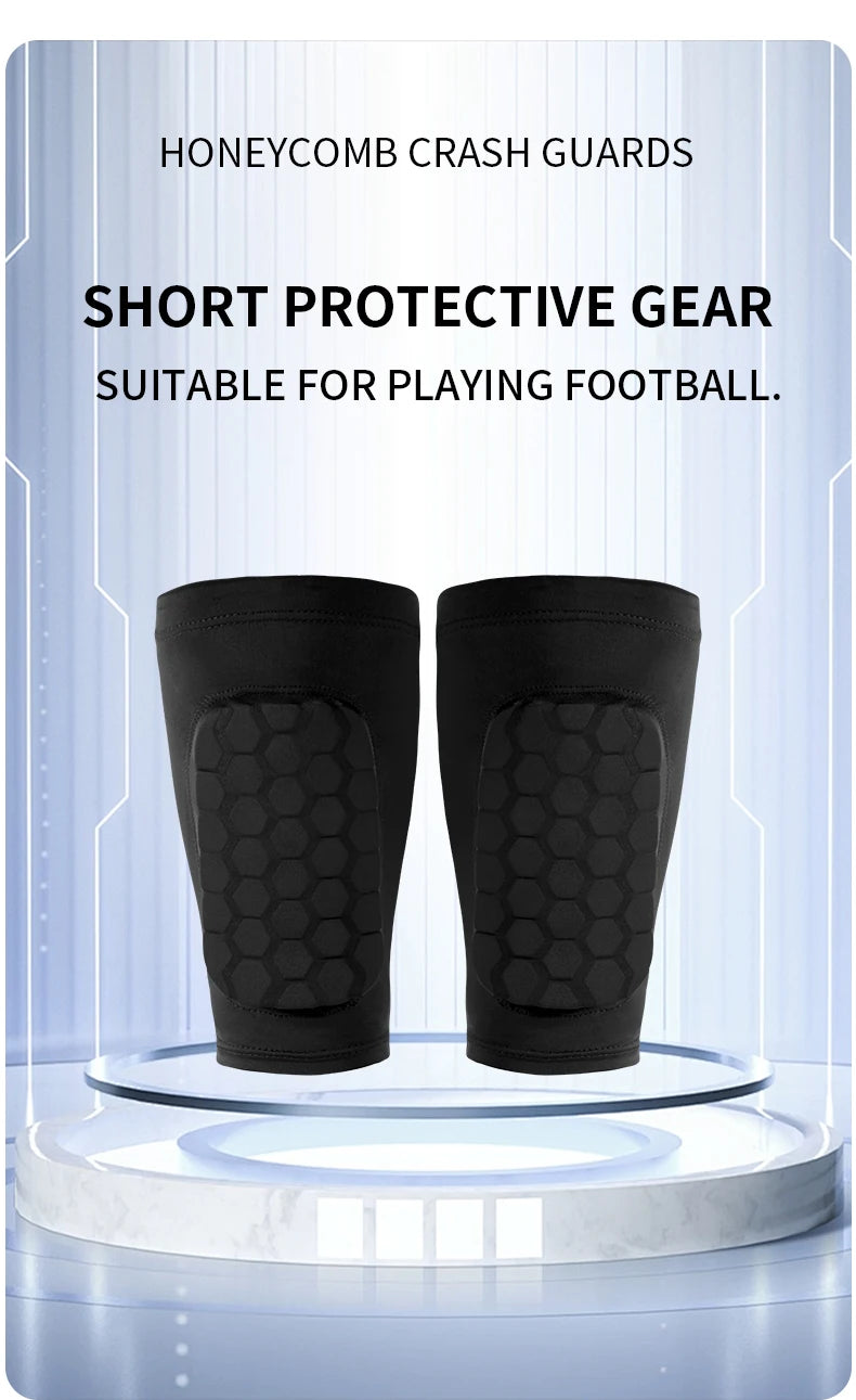 A pair of black honeycomb shin guards displayed on a clear stand for football training.