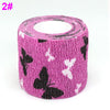Roll of purple elastic bandage tape with a white fruit pattern