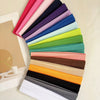 A stack of colorful anti-slip elastic headbands in various shades of pink, purple, blue, green, and yellow.