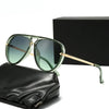 A pair of light green fashion protective sunglasses resting on a black leather pouch next to a black box.