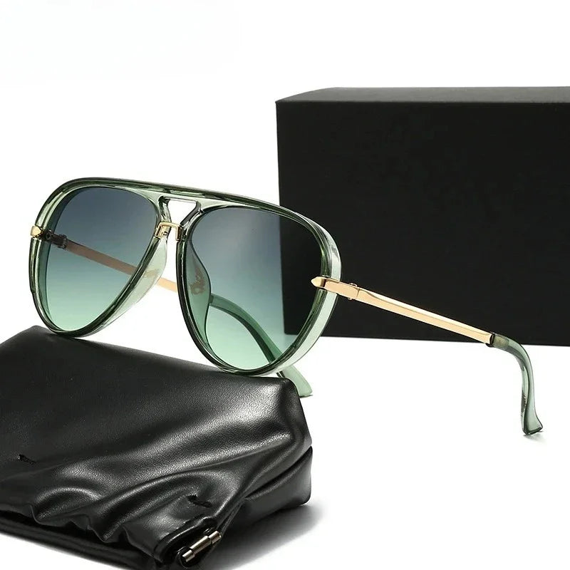 A pair of light green fashion protective sunglasses resting on a black leather pouch next to a black box.