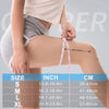 A person is demonstrating the fit of a copper knee compression sleeve on their leg.