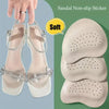 A pair of light pink high heels with non-slip silicone pads shown next to several soft, beige anti-slip forefoot pads.