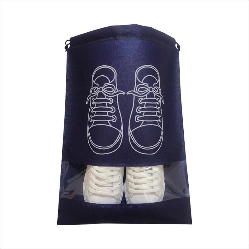 A dark blue reusable non-woven shoe storage bag with a white outline of a pair of sneakers visible through the clear plastic 