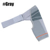 Gray adjustable shoulder support brace with a textured fabric and orange trim