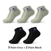 A collection of 5 pairs of ankle socks, including 3 pairs grey and 2 pairs black.
