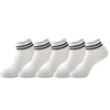 A set of white non-slip grip socks with black stripes for yoga and pilates