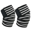 Pair of black and white striped knee wraps for strength training