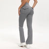 A model wearing gray high-waisted flared yoga leggings with a front pocket detail.