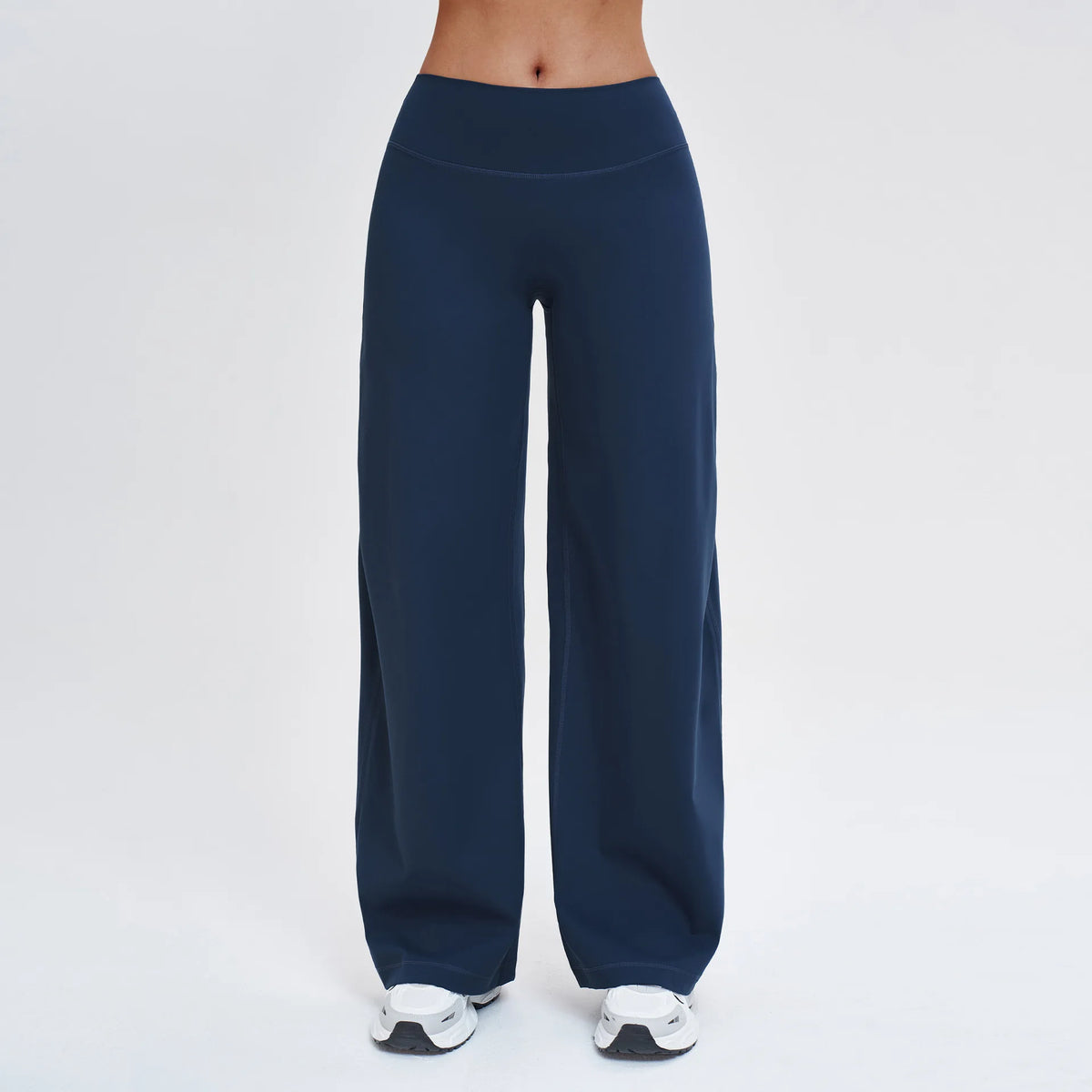 Navy blue high-waist wide-leg yoga leggings worn by a person.