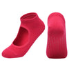 A pair of bright pink breathable women's Pilates and yoga socks, shown from the side.