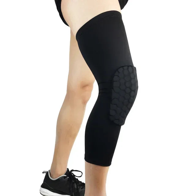 Black compression knee pads worn on a leg, with a black and gray textured insert visible.