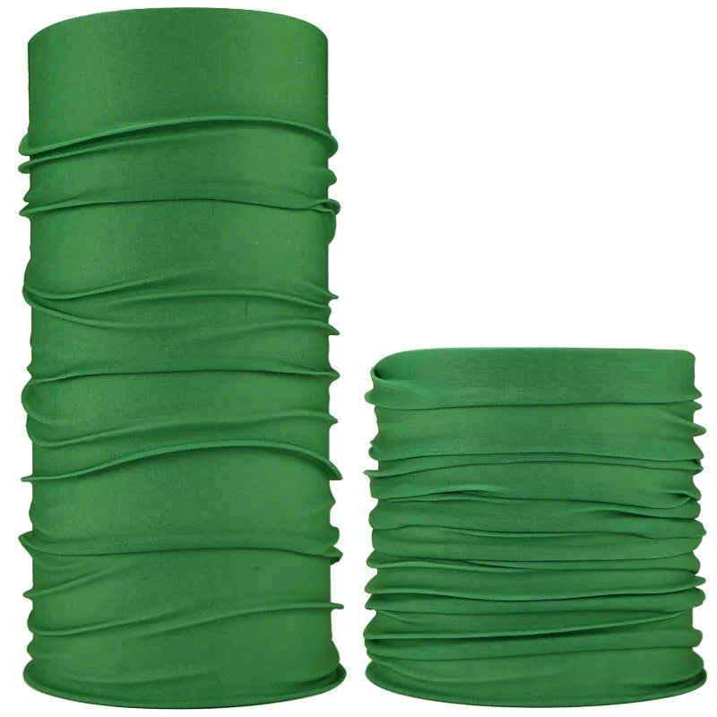 A stack of dark green seamless fabric headbands and balaclavas rolled into cylindrical shapes.