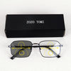 A pair of black photochromic progressive reading glasses are displayed next to their original box labeled ZOZO TOMI.