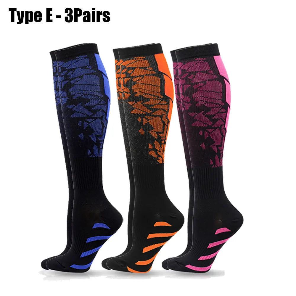 Three pairs of Type E sport compression socks in black, orange, and purple patterns.