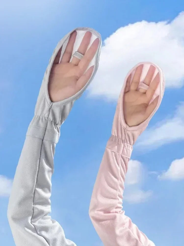 A pair of UV protection arm sleeves, one white and one pink, are shown against a blue sky with clouds.
