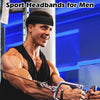A muscular man wearing a black sports headband while exercising in a gym setting.