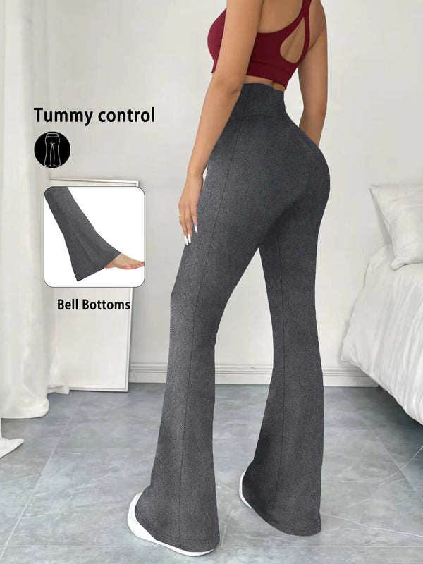 A model wearing dark gray high-waisted yoga leggings with flare details, demonstrating tummy control.