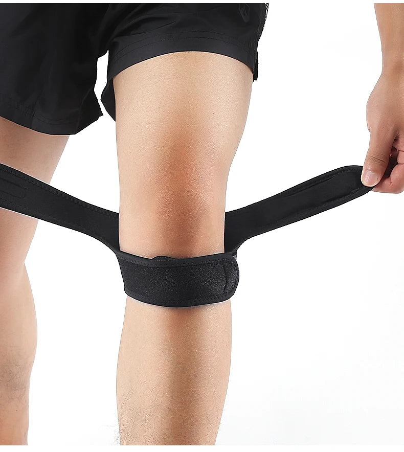 Black pressurized knee support sleeve applied to a person's lower leg.