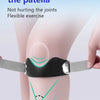 A hand is applying a black silicone V-shaped knee pad to the curvature of a person's patella for joint protection.