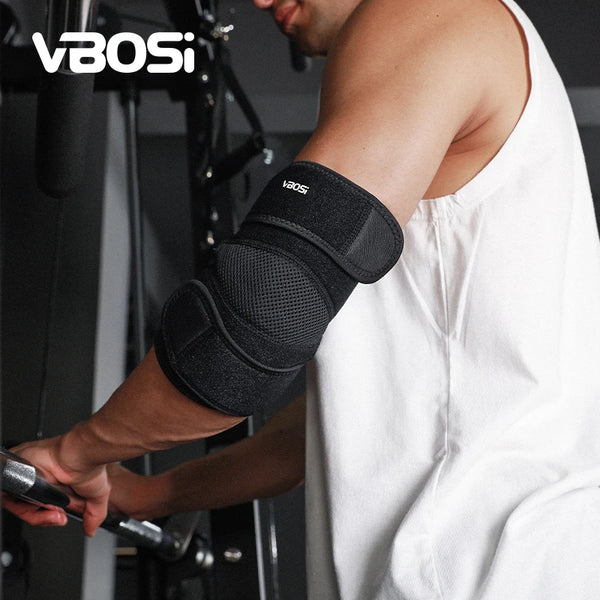 A person wearing a black VBOS elbow support brace while exercising.
