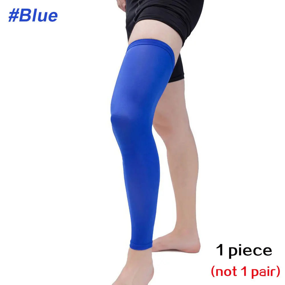 A full leg compression sleeve in royal blue worn on a person's leg.