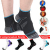 A pair of black compression socks worn on a foot, showing the design and fit.