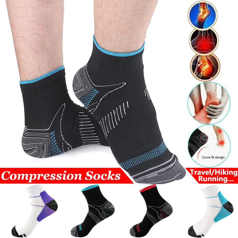 A pair of black compression socks worn on a foot, showing the design and fit.