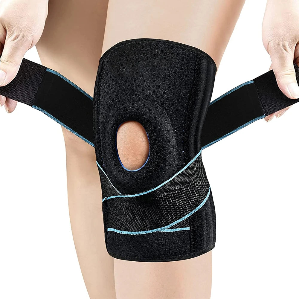 Black knee brace with side stabilizers worn on a person's leg.