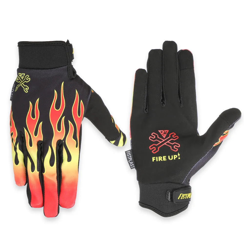 A pair of black motocross gloves with orange and yellow flame accents.