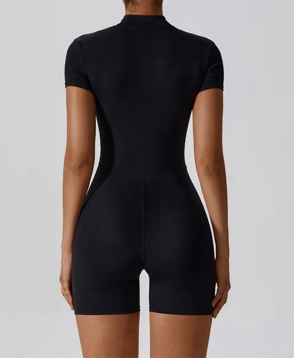 A black women's seamless yoga jumpsuit shown from the back.