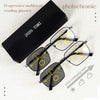 A pair of black photochromic progressive reading glasses are displayed next to their packaging.