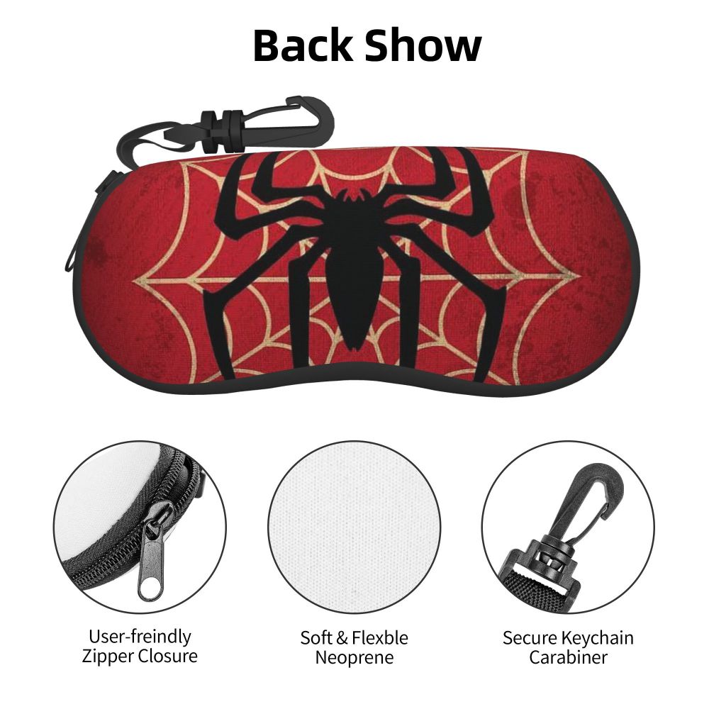 A red pouch with a black spider web design and a keychain carabiner attached.